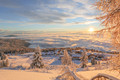 Blick auf das verschneite Skihotel Feuerberg im Winterurlaub in Kärnten